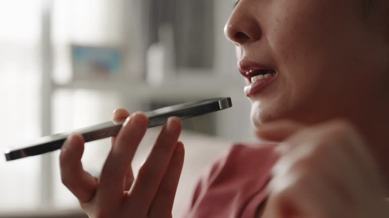 Woman Talking on mobile phone with loudspeaker